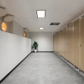 Modern Minimalist Public Toilet Wash Area With Large Backlit Mirror Marble Countertop And Wooden Cabinets