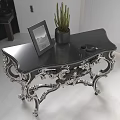 Elegant Black Accent Table With Silver Ornate Carved Legs Photo Frame And Cactus Plant