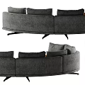 Modern Curved Sectional Sofa With Gray Upholstery And Orange Cushions