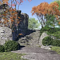 Traditional Garden Landscape With Stone Steps Orange Leaf Trees Green Bushes And Natural Rocks