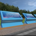 Three Blue Billboards with Green Trees and Red Flowers By Roadside