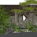Garden Ornamental Scene With Rock Formations White Statue Bamboo Plants Stone Lanterns And Green Foliage