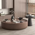 Modern Circular Brown Coffee Table with Books Magazines Vase and Small Gray Side Table 3d model