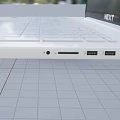 Sleek White Laptop With Ultra Thin Design And High Definition Display Screen For Portable Use