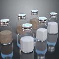 Glass Spice Bottles With Silver Lids Containing Various Seasonings For Kitchen