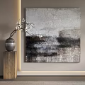 Abstract Painting With Textured Neutral Tones And Wooden Pedestal With White Flowers
