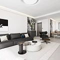 Modern Living and Dining Room With Gray Sofa White Round Coffee Table Black Accent Chair