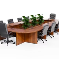 Wooden Office Desk With Black Gray Office Chairs And Green Plants On Tabletop