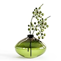 Green Glass Vase With Curved Transparent Body Holding Fresh Green Round Bud Flower Branches