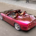 Shiny Red Convertible Sports Car With Open Top Glossy Finish And Sleek Design