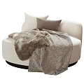 Round Beige Single Sofa with Soft Pillows and Furry Striped Blanket for Cozy Living Space