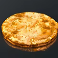 Handcrafted Golden Circular Sculpture With Textured Metal Surface On Black Background