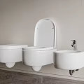 Sleek White Wall Mounted Toilet And Sink In Light Wall Dark Floor Bathroom