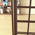 Wooden Bookcase With Multiple Shelves Displaying Books Decorative Items Photo Frames And Bowls