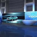 Futuristic Exhibition Display With Illuminated Pillars And Central Exhibit In Modern Architectural Space