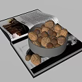 Bowl of Walnuts and Hazelnuts Placed on Open Book with Images and Text