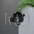 Unique Wall Lamp In Building Seen Through Hole Of Gray Cube With Palm Leaf
