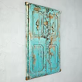 Vintage Blue Wooden Door With Distressed Paint And Carved Leaf Patterns