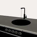 Modern Kitchen Faucet With Water Dripping Into Black Sink On Gray Countertop