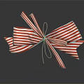 Decorative Ornament Set with Red and White Striped Bow Shiny and Reflective on Dark Surface