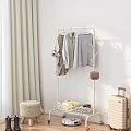 Standing Clothes Rack with Hanging Shirts Striped Tops and Storage Basket Near Curtain and Woven Stool