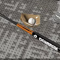 Baseball Sports Equipment Including Demarini Bat Glove And Two Balls On Carpet