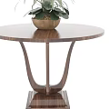 Round Wooden Coffee Table With Potted White Flowers And Elegant Curved Legs