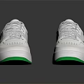 White Athletic Sneakers With Green Accents On Sole And Classic Lace Detail