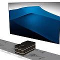 Large Screen Television With Blue Landscape Display On Gray Marble Stand And Black Media Player