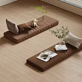 Cozy Living Space With Brown Floor Cushions Throw Pillows Magazines And Potted Plants
