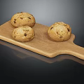 Three Nutty Bread Loaves Placed On Wooden Cutting Board