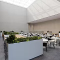 Modern Lounge Area Design With Green Plant Partitions Tables And Natural Light