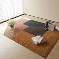 Square Rug with Geometric Pattern Pink Green Brown Orange White Flower Bouquet Folded Newspaper Clothes on Wooden Floor by Window