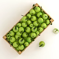 Fresh Green Apples in Wooden Crate with Leaves and Halved Ones Beside
