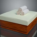 Wooden Storage Box With Light Green Mat And Three Rolled White Towels
