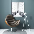 Brown Leather Accent Chair With Curved Design Metal Base Gray Wall Art And Floor Lamp