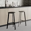 Modern Kitchen Bar Stools in Black and Silver with Wooden Cabinets and Marble Countertop