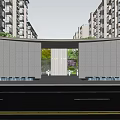 Residential Entrance Gate With Archway Water Features And Greenery Between High Rise Buildings