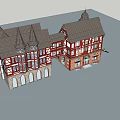 Red White Half Timbered Commercial Complex With Gabled Roofs Multi Story Retail Spaces And Greenery