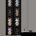 Rabbit Shaped Decorative Ornament Set With Gold Black White Purple Figurines On Display Shelf