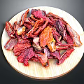 Organic Dried Tomatoes on Wooden Plate for Healthy Snacking