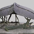 Natural Wooden Pavilion With Curved Tree like Pillars And Stone Bench Seats On Gravel Ground
