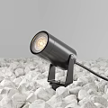 Black Outdoor Light with Round Head Warm Yellow Glow Fixed on White Pebbles Base