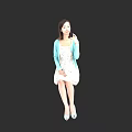 Woman Wearing Light Blue Cardigan And White Dress Sitting In Black Background Holding Item