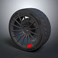 Black Performance Tire With Sporty Tread Pattern And Modern Alloy Wheel Rim Design