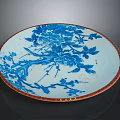 Traditional Porcelain Plate With Blue And White Floral Design And Red Rim