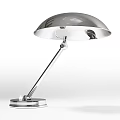 Sleek Silver Metallic Desk Lamp With Adjustable Arm And Round Lampshade