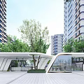 Modern Entrance Gate With High Rise Buildings And Green Trees In Open Space