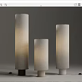 Three Modern Floor Lamps With Cylindrical Fabric Shades And Different Colored Bases