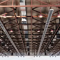 Modern Industrial Ceiling Design With Metal Frames Pendant Lights And Ventilation Grilles